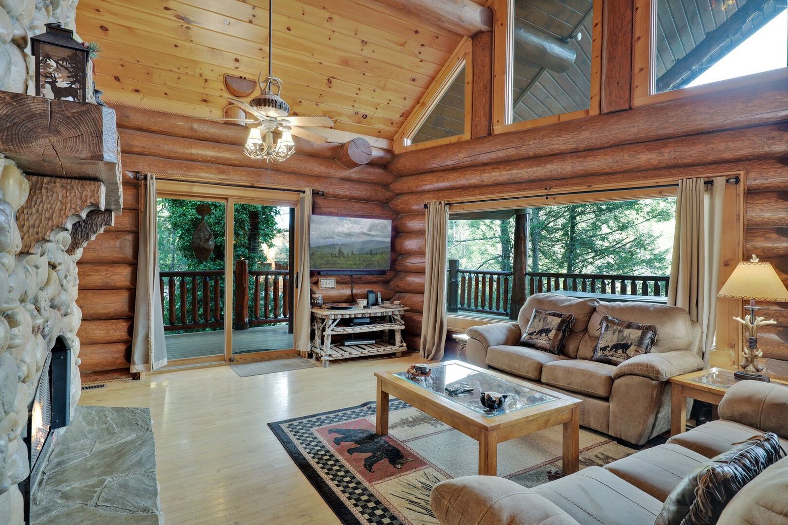 Waters Edge Lodge cozy living room with stone fireplace
